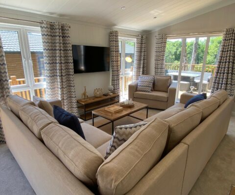 Corner sofa with creamed in a spacious lounge with lots of windows