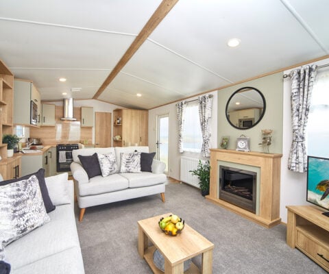 The living room lounge with light sofa and the fire place